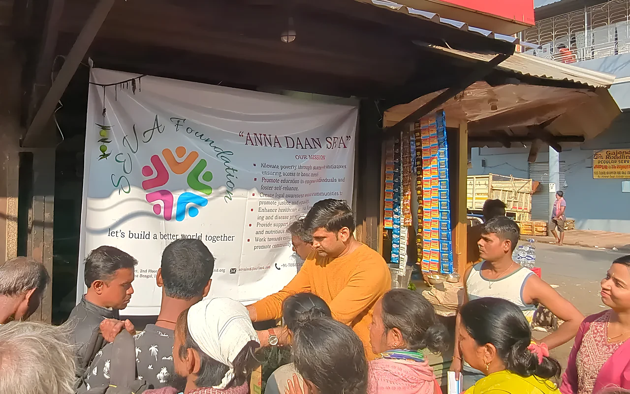 SEVA Anna Daan: crowd at banner